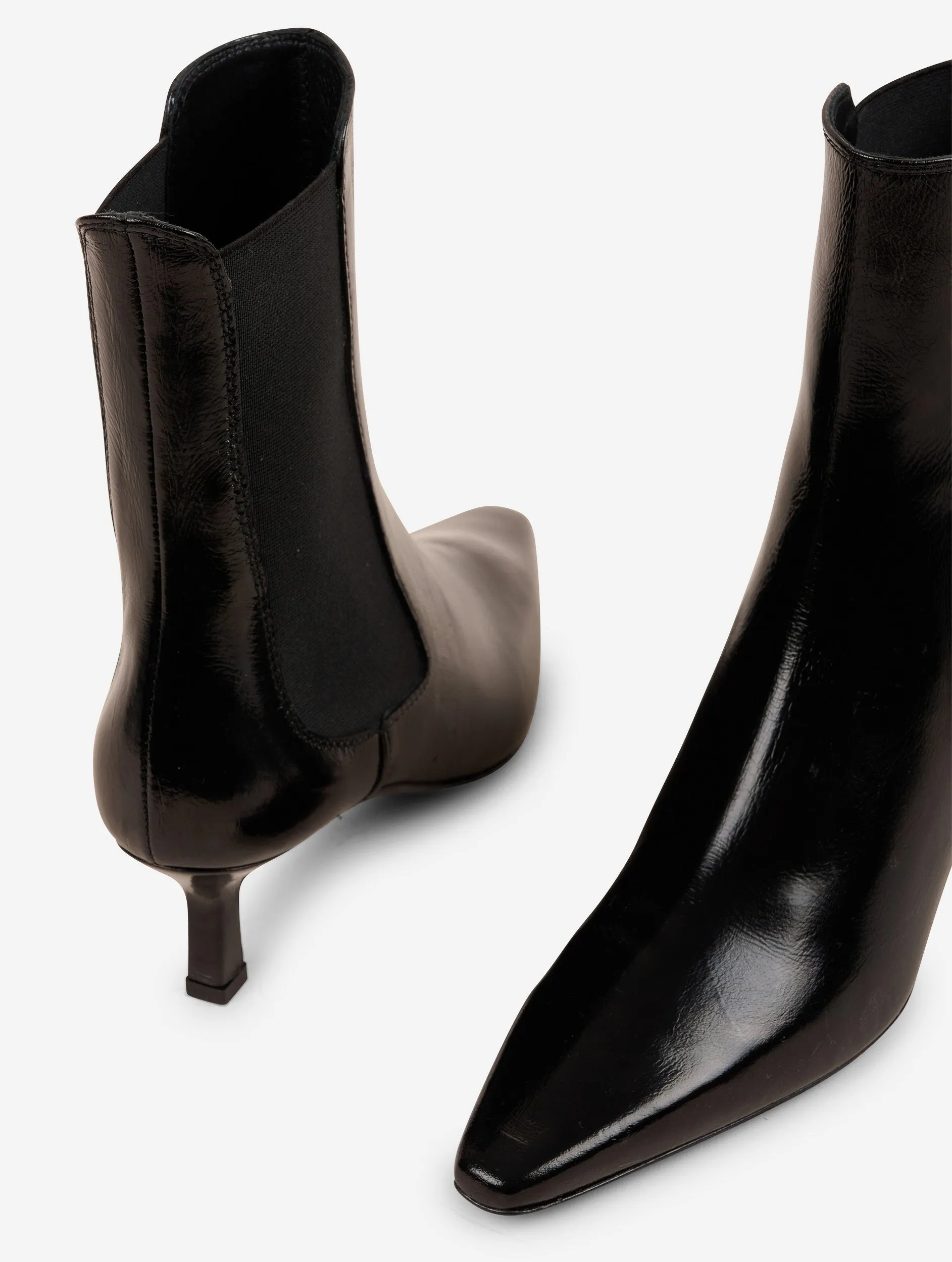 Elasticated black patent leather ankle boots